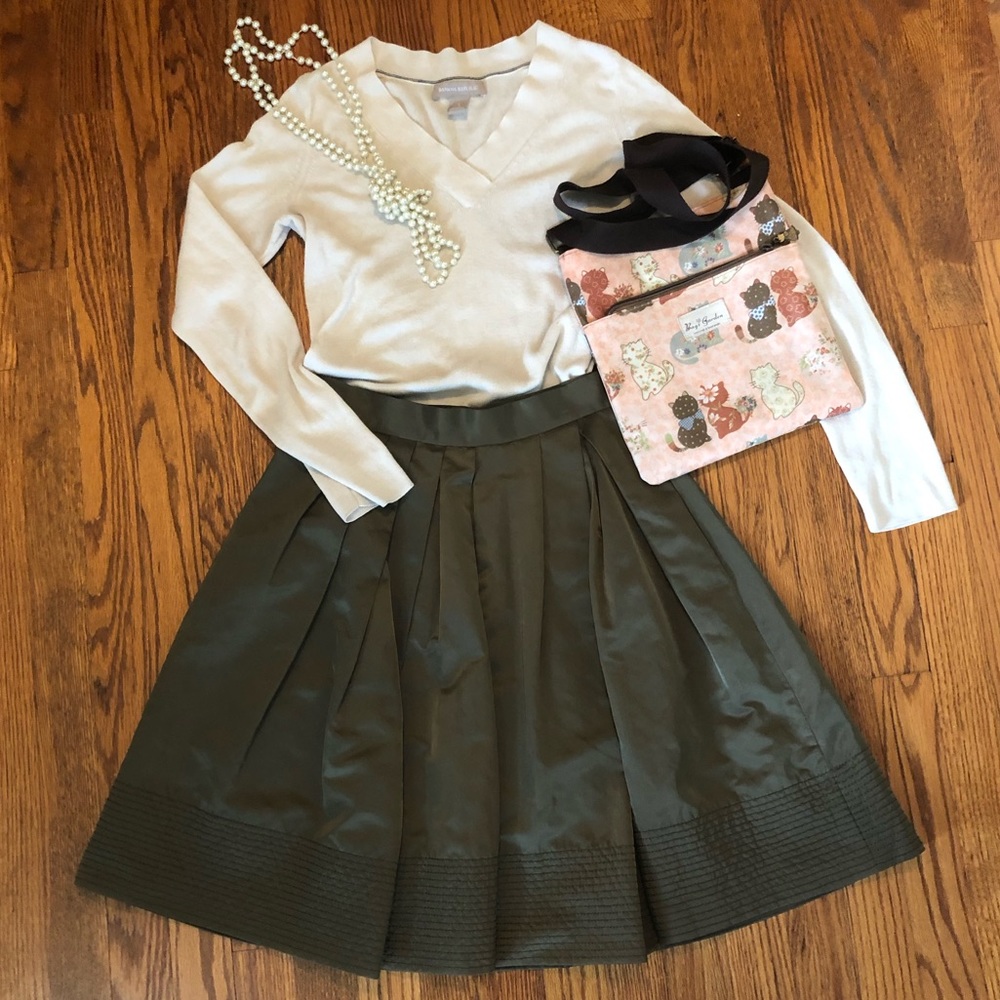 Green pleated knee length skirt